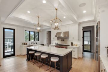 A side view of a countertop bar in the kitchen of a custom modern home.