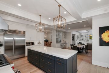 The countertop island in the kitchen of a custom modern home.