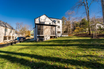 A back view of a large modern home