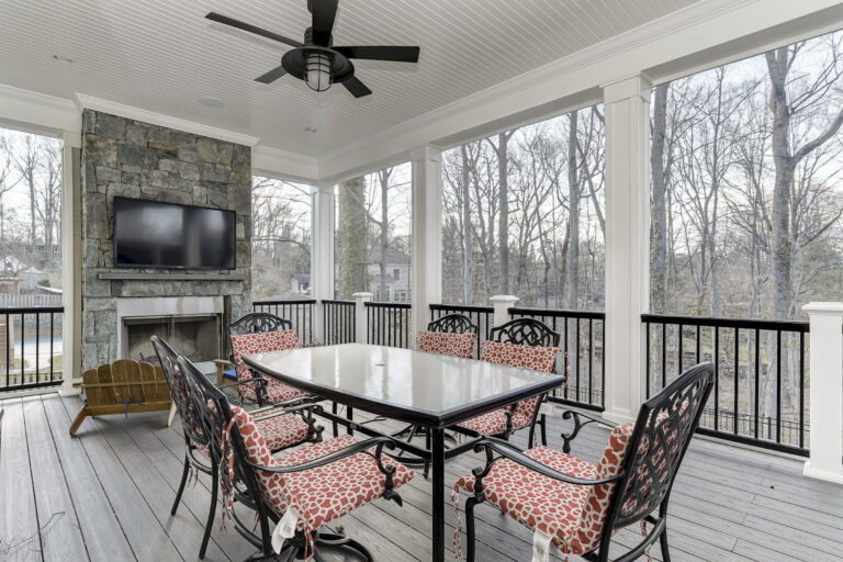 outdoor table with red chair cushions