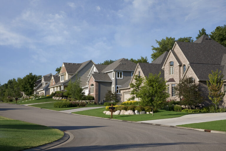 quaint suburban neighborhood rows of houses on a street