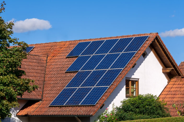 solar panels on a clay tile roof.